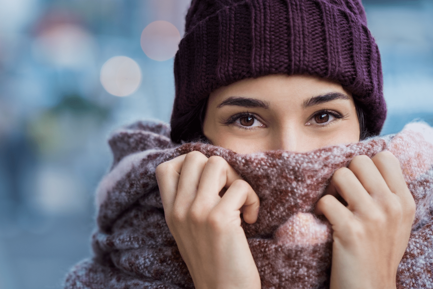 Woman outside in the cold suffering from dry eyes